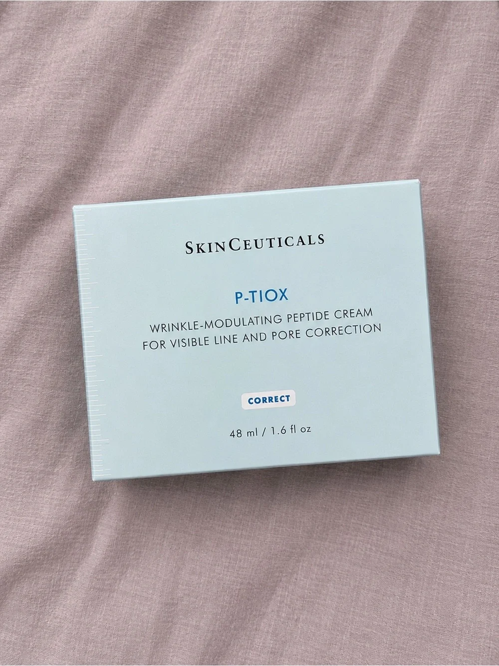 SkinCeuticals P-Tiox Peptide Cream — Light Blue Box on Pink